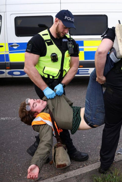 <b>Hot policeman removes protestor</b>